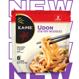 Kä-Mé Udon Stir-Fry Noodles packaging with chopsticks and noodles on a white background