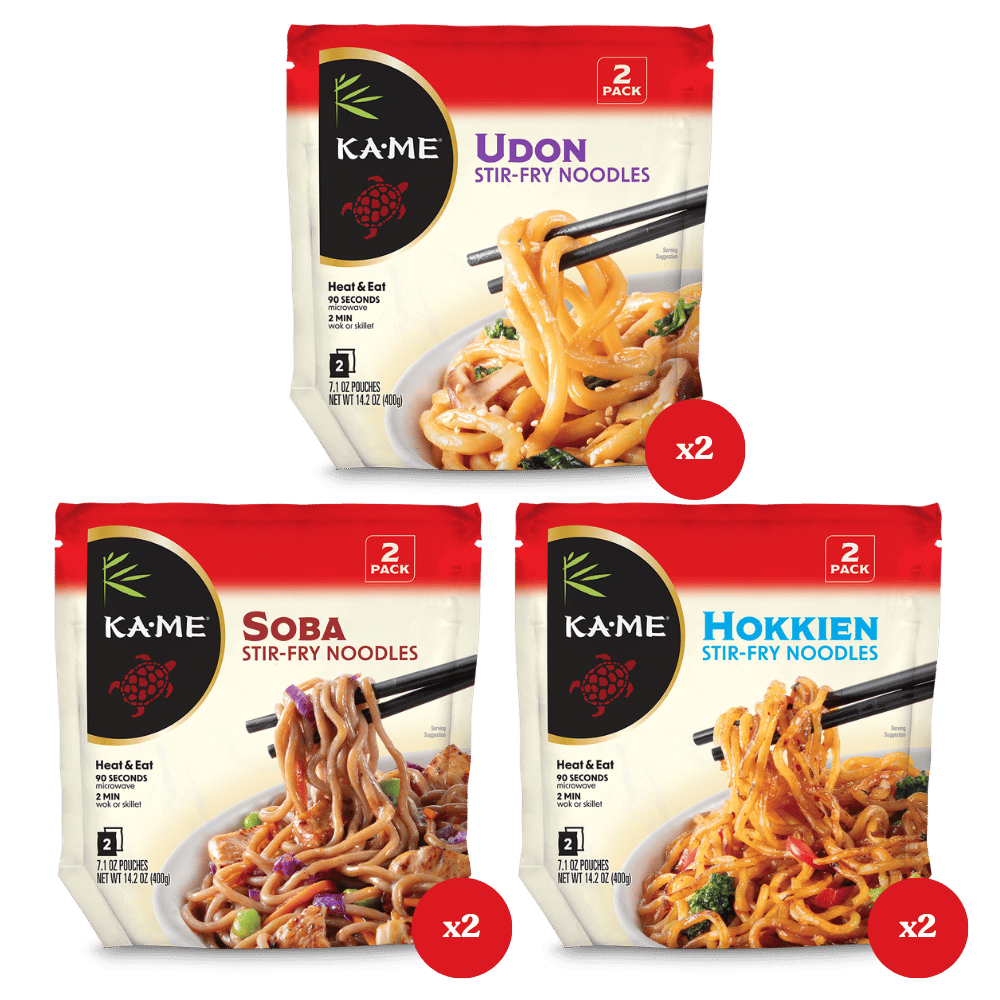 Three Kame Stir-Fry Noodle pouches arranged on a white background: Udon, Soba, and Hokkien. Each pouch shows a 2-pack quantity and includes a red circular 'x2' badge below it.