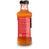 A bottle of KA-ME Duck Sauce, showing the back label with product details, set against a plain white background.