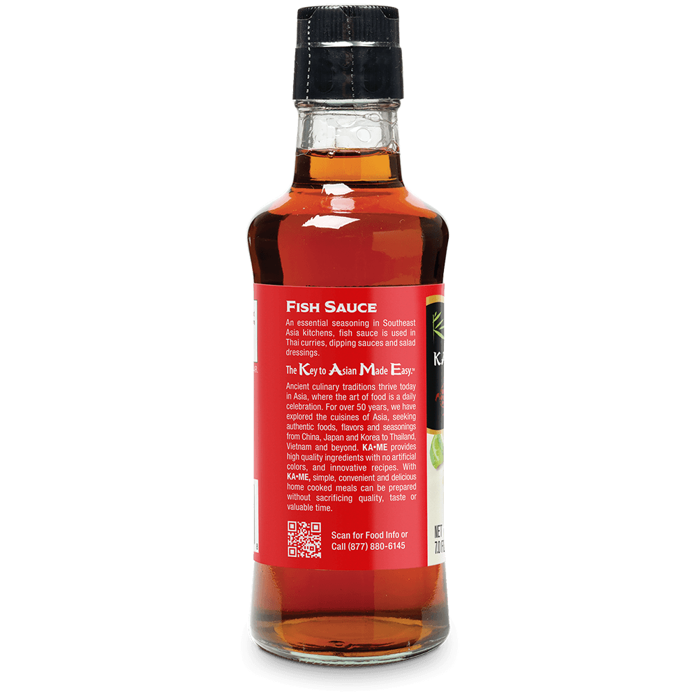 A bottle of Kome Fish Sauce, showing the back label and amber liquid inside, on a white background.